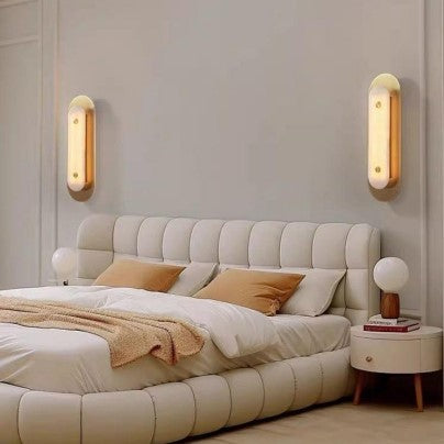 A modern luxury wall sconce featuring