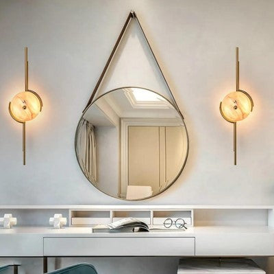 A modern luxury wall sconce featuring