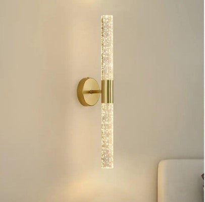 A modern crystal bubble wall sconce.